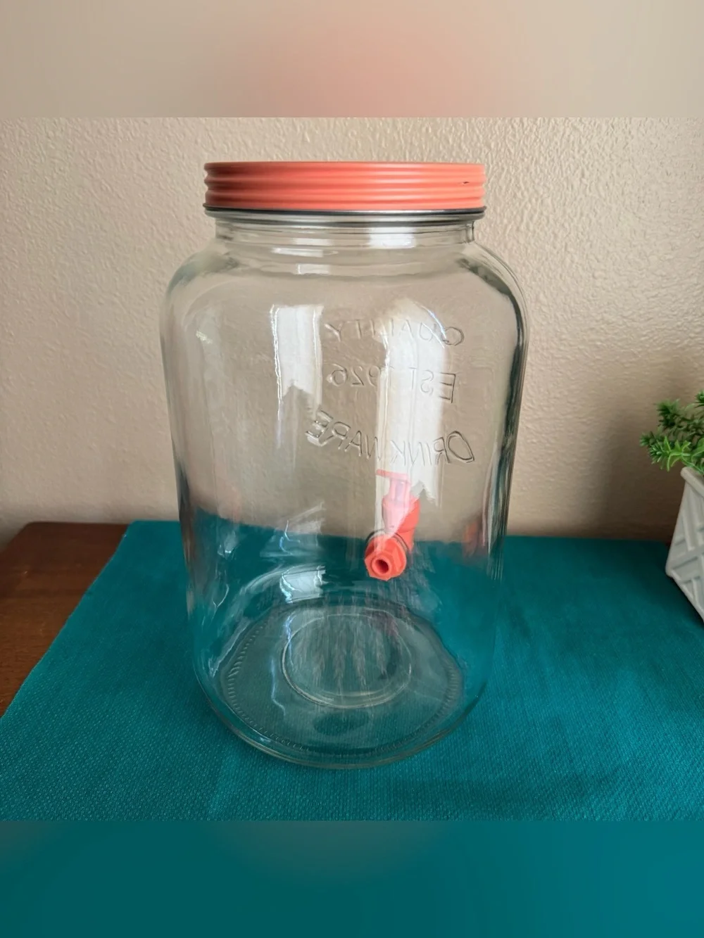Quality Drinkware large beverage dispenser with salmon pink/peach lid
